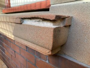 Synthetic stone windowsill before repairs