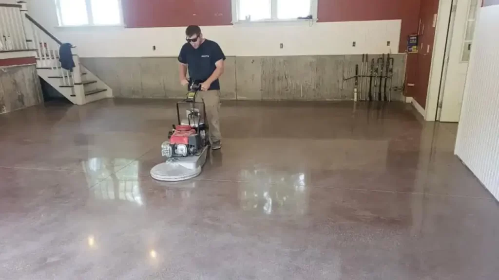 a man doing concrete polishing with polishing machine