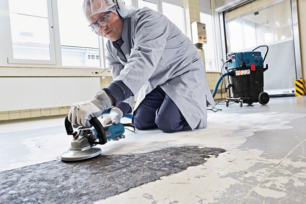 person working on concrete floor