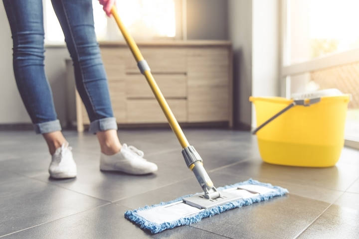 women cleaning concrete floor