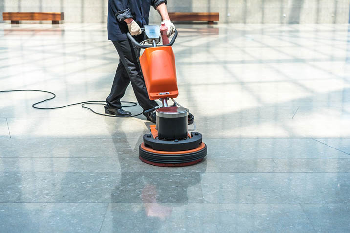 person polishing concrete with polishing machine