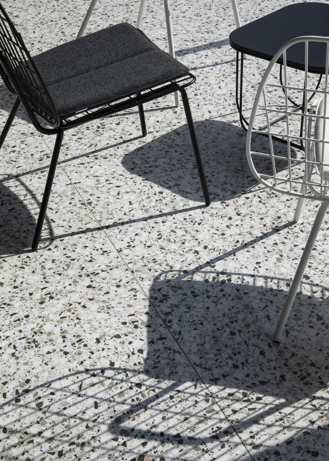 black metal framed padded chair on floor
